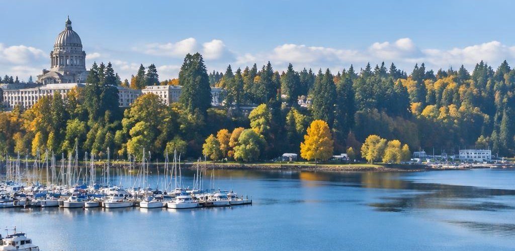 Illustrative Pacific Northwest lifestyle scene accompanying Nebraska vs. Washington State: Cost of Living and Lifestyle Guide