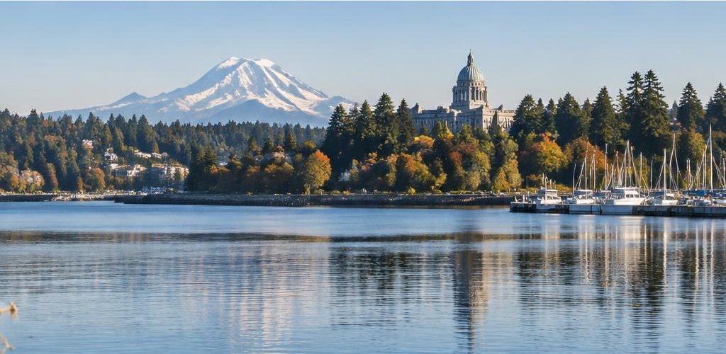 Illustrative Pacific Northwest lifestyle scene accompanying Maryland vs. Washington State: Moving to Olympia Guide